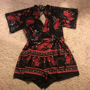 Francesca’s Floral Printed Open Back Romper